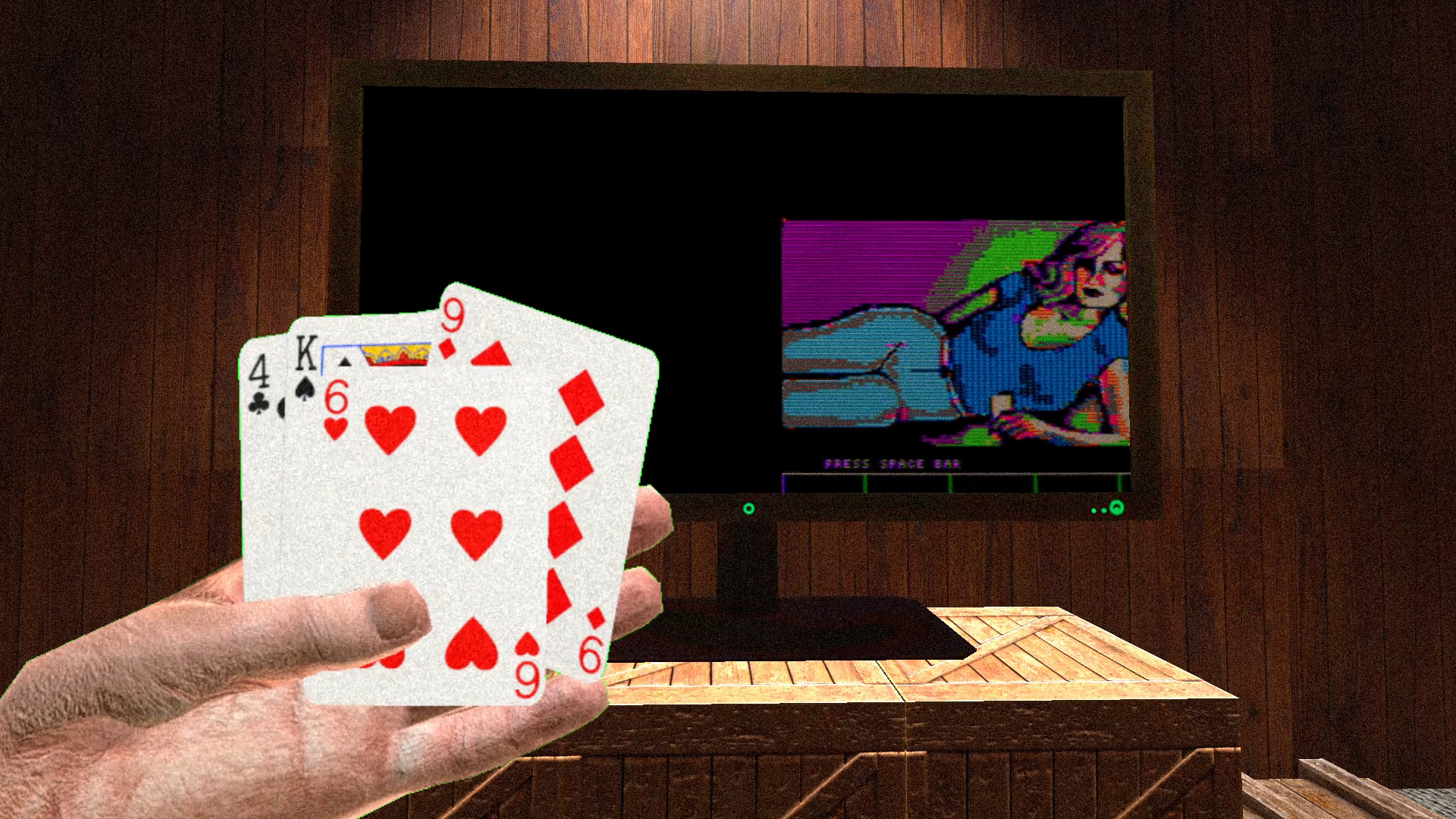 A virtual reality render that shows a hand in the foreground holding playing cards. Behind is a desk and computer. The screen shows a loading screen for a computer game