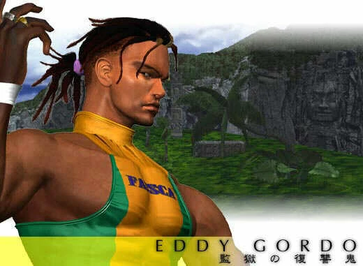 A video game screenshot of tekken - Eddy Gordo is a Black man with hair in a bun standing in a yellow and green leotard on a beach in front of a cliff